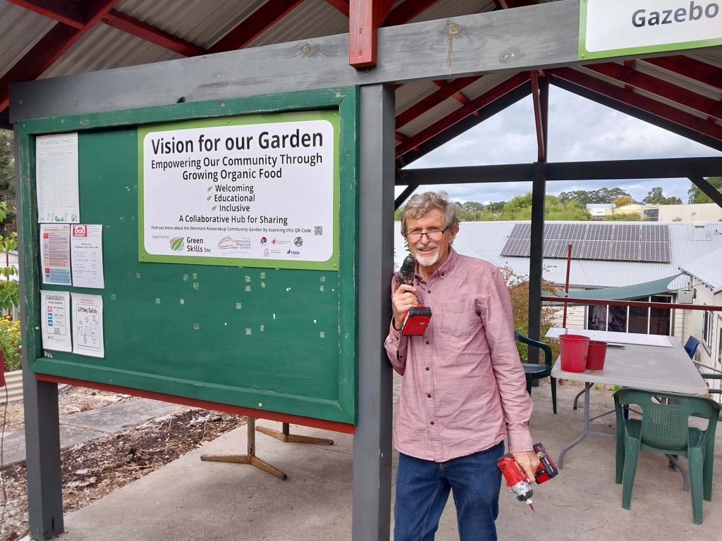 DCG Graham volunteer handyman installs new signage