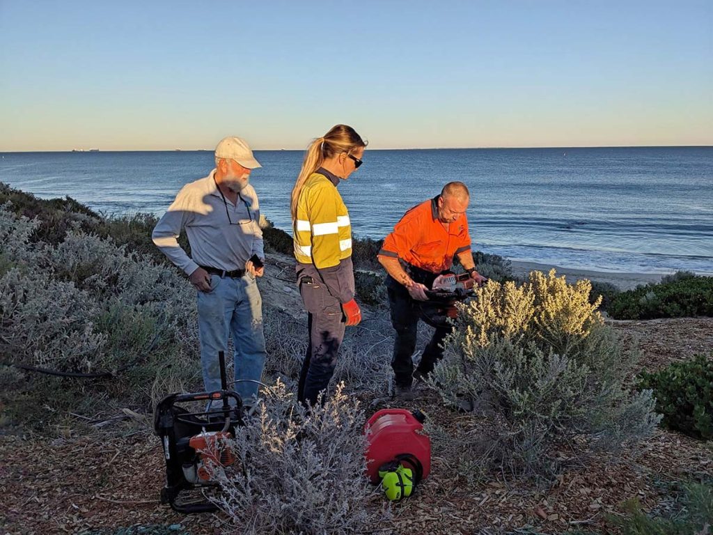 Cottesloe coast care, augering holes for community planting.